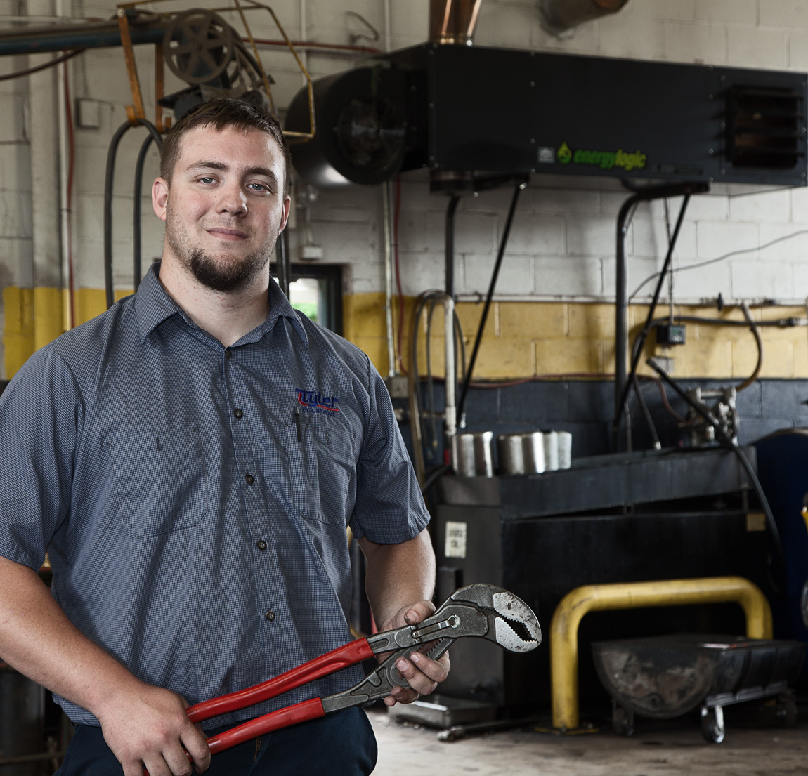 Independent Garage Interior with Cars and Mechanic